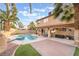 Inviting backyard oasis featuring a sparkling pool and spa at 9675 Summer Lilac Ct, Las Vegas, NV 89123