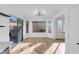 Bright dining area with wood floors and sliding glass doors to the patio at 10960 Vallerosa St, Las Vegas, NV 89141