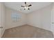 Well-lit bedroom with ceiling fan and carpeted floors at 1120 Tropic Wind Ave, North Las Vegas, NV 89081