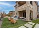 Covered patio with seating area, artificial turf, and a view of the pool at 12404 Liberty Beacon Ave, Las Vegas, NV 89138