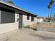 Single story home with a gated entrance and a small yard at 1812 Ryan Ave, Las Vegas, NV 89101