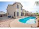 Large kidney-shaped pool with a spacious patio at 227 Palmarosa St, Henderson, NV 89015