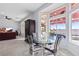 Bright dining area with glass table and chairs near pool view at 2540 Youngdale Dr, Las Vegas, NV 89134