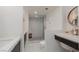 Large bathroom with marble shower, toilet, and dual vanities at 3111 Bel Air Dr # 12G, Las Vegas, NV 89109