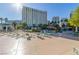 Relaxing pool area with lounge chairs and a view of the city at 322 Karen Ave # 505, Las Vegas, NV 89109