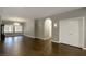 Dining area with a chandelier, wood-look tile flooring, and access to a hallway at 427 Norridgewock St, Henderson, NV 89074