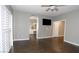 Spacious main bedroom with wood-look tile floor and ensuite bathroom access at 427 Norridgewock St, Henderson, NV 89074