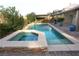 Backyard featuring a refreshing pool, a relaxing spa, and a paved patio at 427 Norridgewock St, Henderson, NV 89074