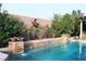 Close-up of the pool's water features, including cascading waterfalls and decorative elements at 427 Norridgewock St, Henderson, NV 89074