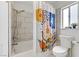 Clean bathroom with shower/tub combo and patterned shower curtain at 4330 Flandes St, Las Vegas, NV 89121