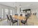 Dining room with a long wooden table and black chairs at 4330 Flandes St, Las Vegas, NV 89121