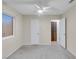 Bedroom with neutral walls, gray carpet, a ceiling fan, and a window with blinds at 4475 El Carnal Way, Las Vegas, NV 89121