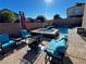 Relaxing patio with fire pit and seating area overlooking the pool and spa at 51 Sirius Ridge Way, Las Vegas, NV 89183