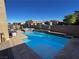 Large rectangular pool with a spa and waterfall feature at 51 Sirius Ridge Way, Las Vegas, NV 89183