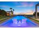 Expansive pool with city views at sunset, perfect for entertaining at 6160 Banded Stones Ct, Las Vegas, NV 89135