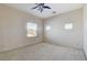 Well-lit bedroom with ceiling fan and neutral decor at 6205 Red Pine Ct, Las Vegas, NV 89130