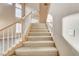 Elegant staircase with carpeted steps and wooden railing at 6205 Red Pine Ct, Las Vegas, NV 89130