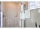 Bright shower with glass enclosure and white tile at 7830 Pandora Sky St # 192, Las Vegas, NV 89084