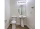 Clean and bright bathroom with pedestal sink and toilet at 9421 Wisdom Valley Ave, Las Vegas, NV 89149