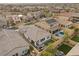 Aerial view showcasing house, pool, and putting green at 9876 Cullin Range Ave, Las Vegas, NV 89166