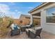 Relaxing backyard patio with seating area and fire pit at 9876 Cullin Range Ave, Las Vegas, NV 89166