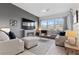 Bright and airy living room featuring a fireplace and ample seating at 9876 Cullin Range Ave, Las Vegas, NV 89166