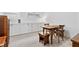 Home office with built-in white cabinets and rustic wooden table at 9876 Cullin Range Ave, Las Vegas, NV 89166