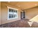 Brick paved covered patio with access to the front door at 10534 Riley Cove Ln, Las Vegas, NV 89135