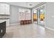 Kitchen features breakfast nook and sliding door to backyard at 133 S Buteo Woods Ln, Las Vegas, NV 89144