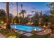 Tranquil pool area with multiple fountains and fire features at 2024 Troon Dr, Henderson, NV 89074