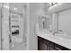 Modern bathroom with dark brown vanity and a mirror at 228 Cromarty St, Henderson, NV 89012