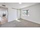 Bright bedroom with grey carpet and barn door at 2914 Congress Ave, Las Vegas, NV 89121