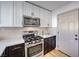 Modern kitchen features stainless steel appliances and two-tone cabinetry at 2914 Congress Ave, Las Vegas, NV 89121