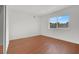 Well-lit bedroom with wood flooring and a window at 4273 Sun Vista Dr, Las Vegas, NV 89104