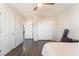 Bedroom with wood flooring and ample closet space at 8132 Celina Hills St, Las Vegas, NV 89131