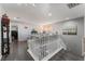 Upstairs hallway with hardwood floors and white railings at 8132 Celina Hills St, Las Vegas, NV 89131