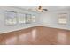 Large bedroom with ceiling fan and hardwood floors at 9570 Newton Grove Ct, Las Vegas, NV 89148