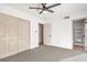 Well-lit bedroom with carpet, closet, and bathroom access at 1000 Macfarlane St, Las Vegas, NV 89101