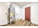 Laundry room with new water heater and wood-look flooring at 1000 Macfarlane St, Las Vegas, NV 89101