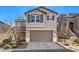 Two story home with attached garage and neutral color scheme at 10421 Mount Washington Ave, Las Vegas, NV 89166