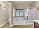 Clean bathroom with a bathtub, shower, and updated fixtures at 1321 Robbers Roost Ave, Henderson, NV 89012