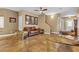 Spacious living room featuring a leather couch and stylish armchairs at 1321 Robbers Roost Ave, Henderson, NV 89012