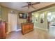 Home bar with granite countertop and wooden cabinetry at 1590 Sabatini Dr, Henderson, NV 89052