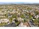 Aerial view of a home in a planned community with a mountain view in the distance at 2110 Strada Mia Ct, Las Vegas, NV 89117