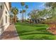 Landscaped backyard with a gazebo and artificial turf at 2110 Strada Mia Ct, Las Vegas, NV 89117