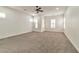 Bright bedroom featuring a ceiling fan and multiple windows at 2325 Janesville Ln, Henderson, NV 89044