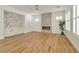 Living room featuring hardwood floors and a marble accent wall at 2325 Janesville Ln, Henderson, NV 89044