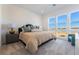 Bright bedroom with large windows offering scenic views and plush bedding at 2486 Indigo Mountain St, Henderson, NV 89044