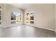 Bright and airy living room with large windows and tile flooring at 2511 Silent View Ave, Henderson, NV 89044