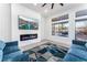 Living room featuring a modern fireplace and large TV at 2717 Vista Butte Dr, Las Vegas, NV 89134